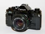 Daiktas Canon A-1 su objektyvu