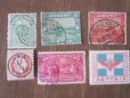 Daiktas Įvairūs seni pašto ženklai.