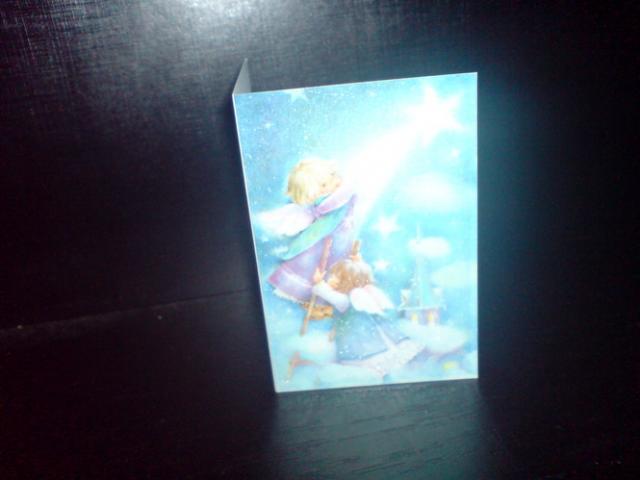 Daiktas kaledine atvirute su mergaite