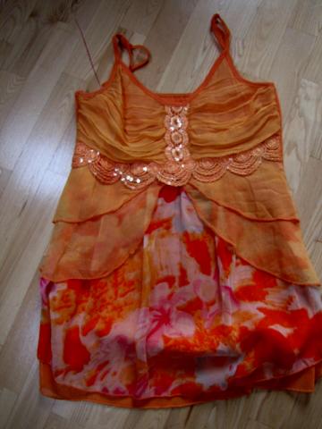 Daiktas Moteriška ryški palaidinė.