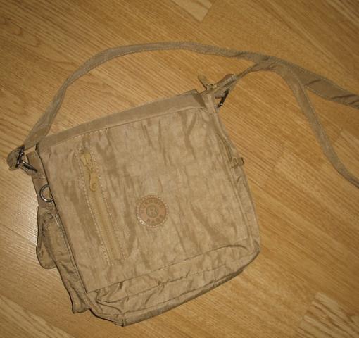 Daiktas tašė per petį