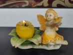 Daiktas Keramikinė statulėlė- žvakidė Mažoji fėja prie gėlės. 