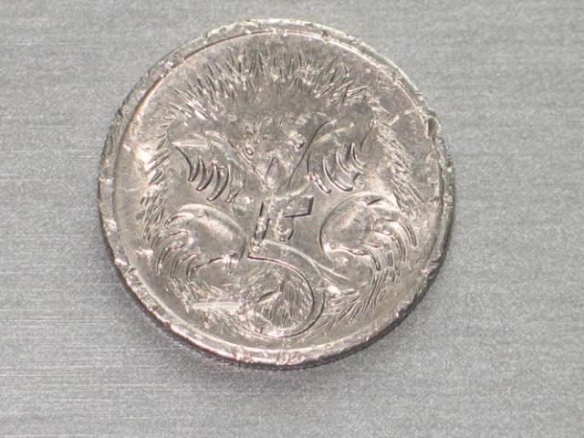 Daiktas australiska ir suomiska monetos